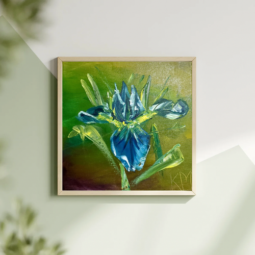 Small square painting of a blue iris hanging on a wall featuring a tan frame